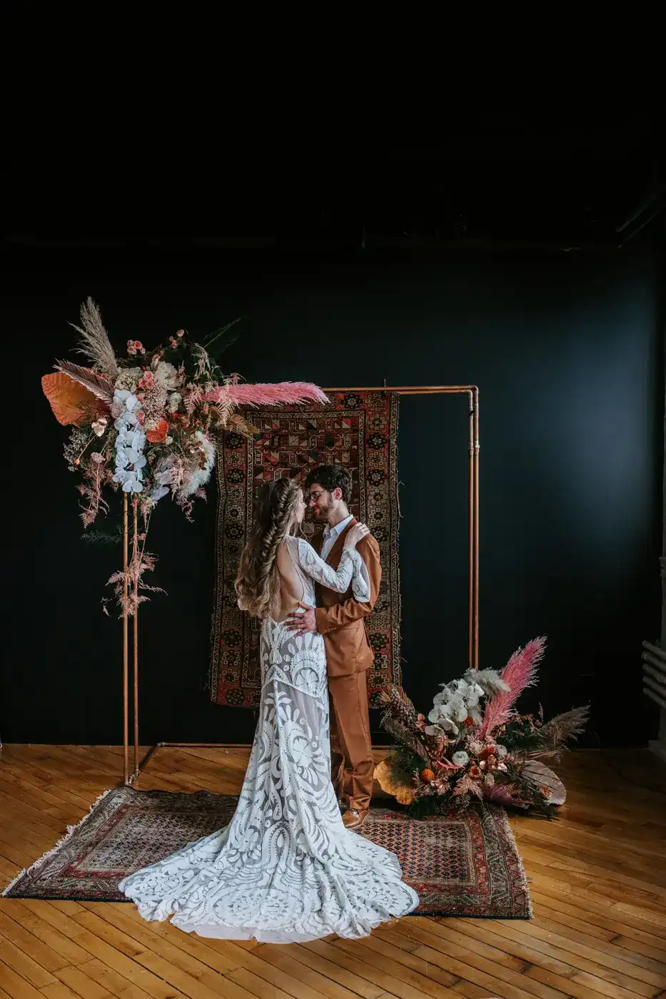 Couple posing in styled bohemian decor